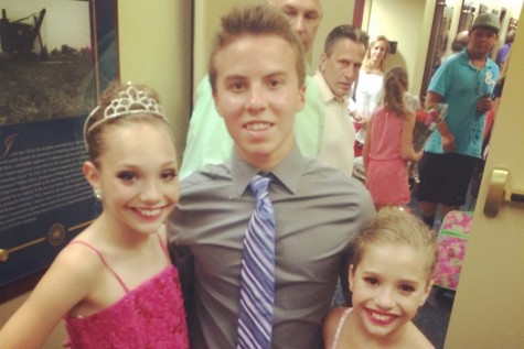 Ian is shown here with Maddie and McKenzie, two of the stars of the show Dance Moms.