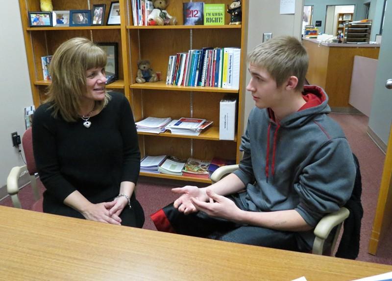 High School Assistant Principal talks with junior  Cole Kerns.  Mrs. Adams is a proponent of strong anti-bullying campaigns in schools.