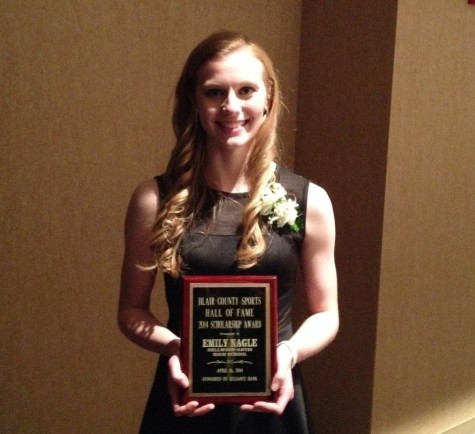 Emily Nagle with her scholarship plaque.