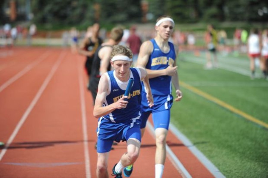 Noah+DAngelo+hands+off+to+anchor+Alex+Bartlett+for+the+final+leg+of+the+4X800+relay+yesterday+at+the+District+6-AA+track+and+field+championships+at+Mansion+Park.++Bartlett+finished+strong%2C+and+the+Blue+Devil+relay+team+won+the+race.