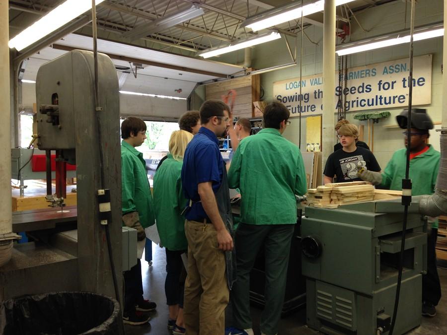 Mr. Webreck works with students in his Ag Mechanics class.
