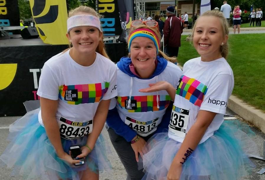 Bellwood-Antis ninth graders Alexis Gerwert (left) and Tierra Mahute (right) pose with B-A majorette instructor Scarlet Kennedy at the Color Run.
