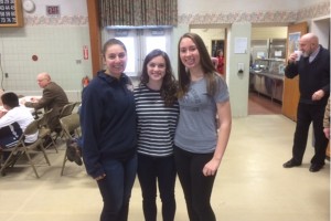 Juniors Abbey Crider, Marissa Panasiti and Christina Kowalski helped to serve drinks at the luncheon following the march.