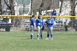 BA outfielders Rachel Harris, Saige McElwain and Caroline Showalter have a chat during Saturday's win over Tyrone.