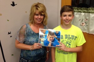 Karen Miller can see middle-schooler Trevor as she works in the guidance office, as well as senior Tyson.