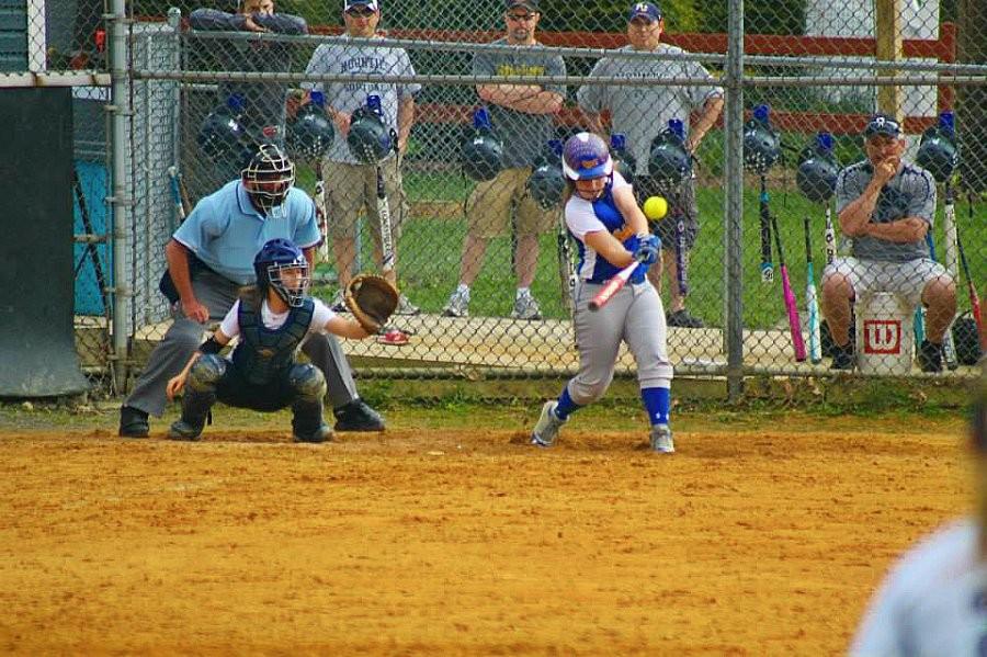 Jacqueline Finn blasts as home run yesterday against P-O. The Lady Mounties won 5-3.