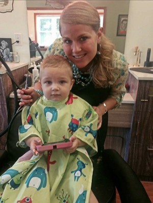 Laura has customers both old and young at her new barbershop.
