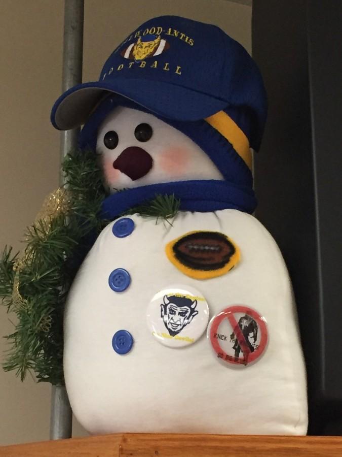 Mrs. Zong already has her snowman mascot decked out in the first two NHS football pins.