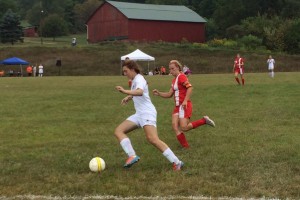 Reagan Plowman moves past a West Branch player. Plowman was part of a defense that shut out the Warriors in the 10-0 win.