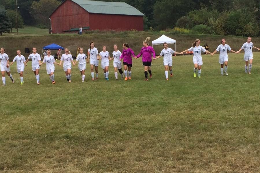 The co-op soccer team was dominant in its first game Saturday and earned a well-deserved ovation.