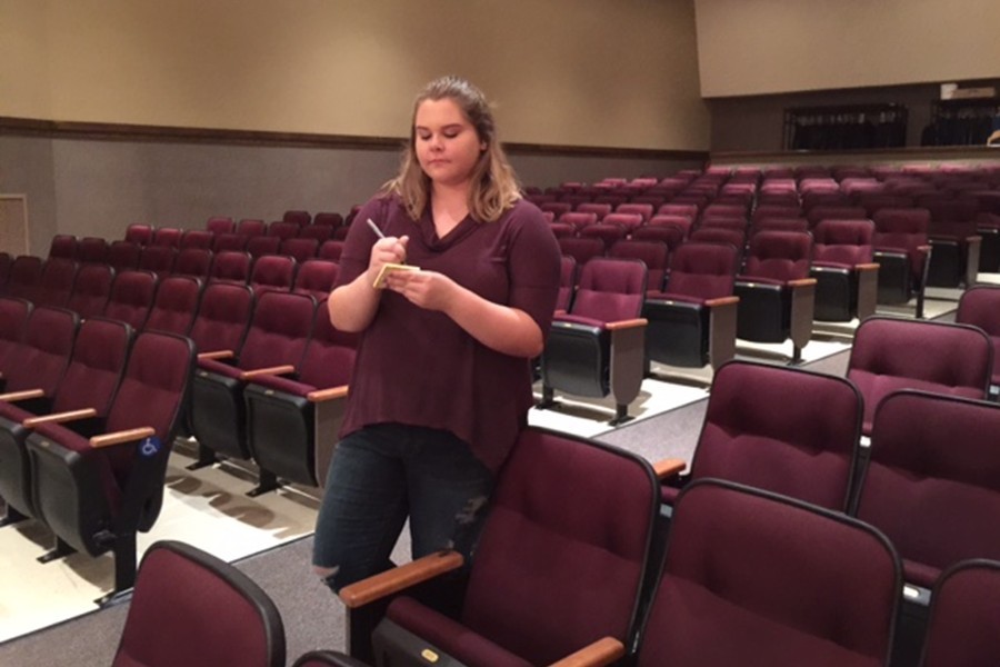 Leo Club members like Makala Doyle and Mariah Younker, shown above setting up the auditorium, are taking Skit Night in a new direction this year.