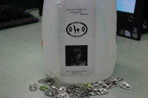 Each classroom has an empty milk carton to store pop tabs in support of service dogs.