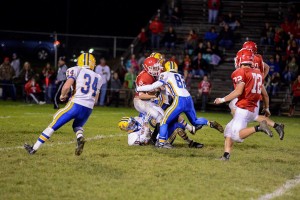 Brandon Friedenberger gets after the running back in the backfield last Friday at Everett.