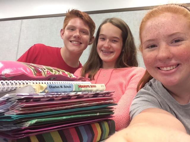 A few Newspaper Club member take time out from writing articles to snag a selfie.