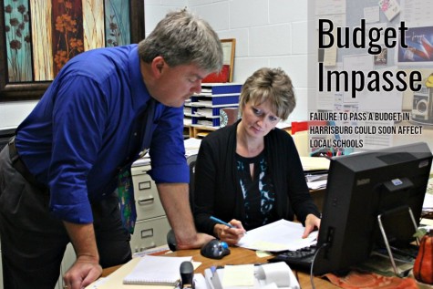 Superintendent Dr. Thomas McInroy and business manager Kim Van Gorder look over budget figures. McInroy said BASD has been able to avoid taking out loans to pay the bills as a result of a state budget stalemate.