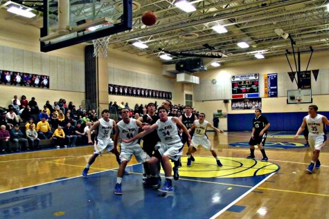 The boys basketball team looks for the rebound.