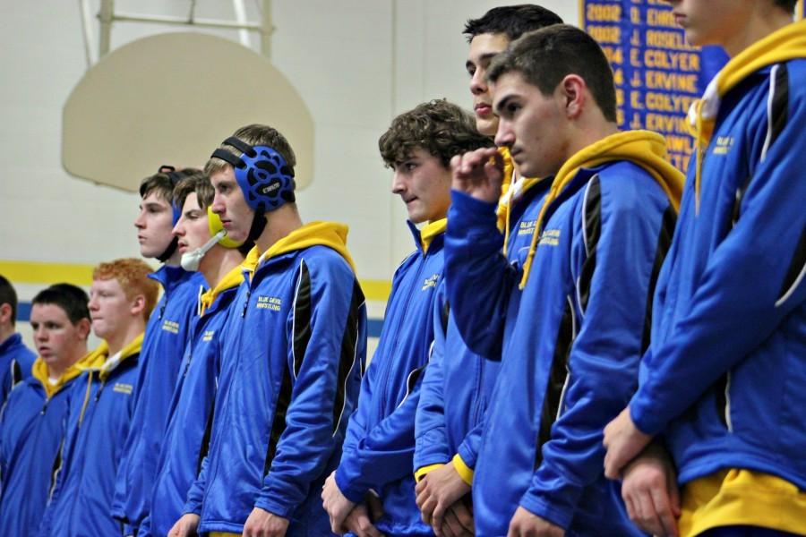 The wrestling team gets focused before its match against Everett.