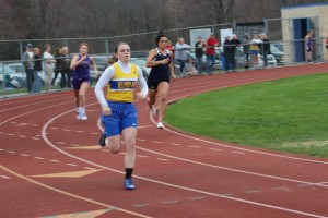 Senior Marissa Panasiti rounds into the home stretch to win the 400 meter run yesterday against Hollidaysburg and Bishop Guilfoyle.