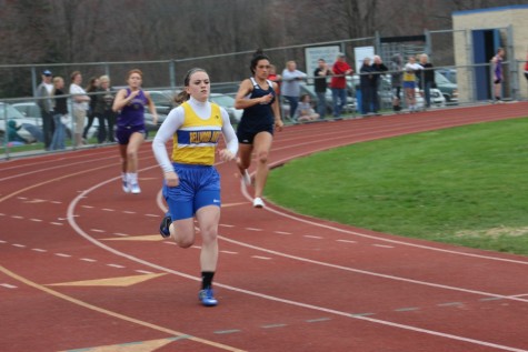 Senior Marissa Panasiti rounds into the home stretch to win the 400 meter run yesterday against Hollidaysburg and Bishop Guilfoyle.