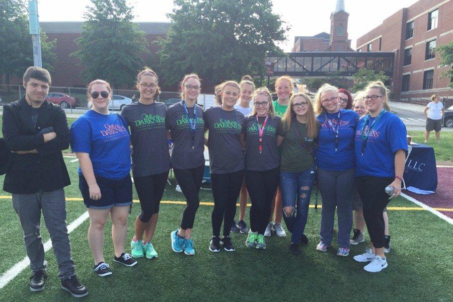 Students pose for a picture in their Out of the Darkness Walk t-shirts.