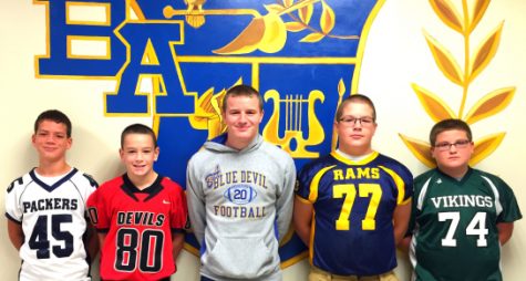 Senior Ryan Beam is surrounded by the next generation of Bellwood football players.
