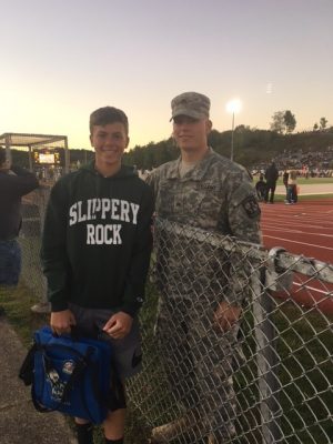 Tyson, shown with his brother Trevor, a B-A ninth grader, at a Slippery Rock game where he was a member of the honor guard.