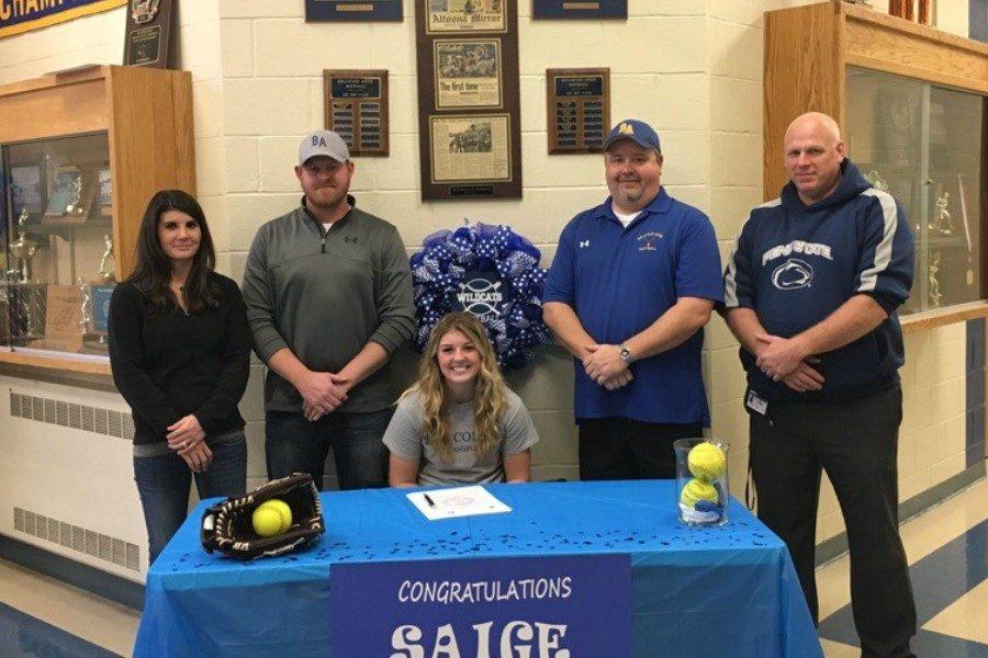 Siage+McElwain+signed+to+play+at+Penn+College+last+week+at+a+ceremony+that+was+attended+by+her+parents%2C+friends+and+coaches.