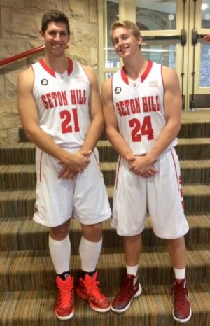 Nathan and Noah Davis pose outside of the gym at Seton Hill.