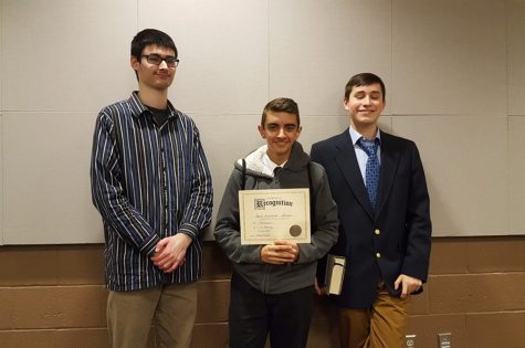 Dan Kustaborder, flanked by Zion Poe (left) and Isaac Patton (right) won the declamation category at District speech.