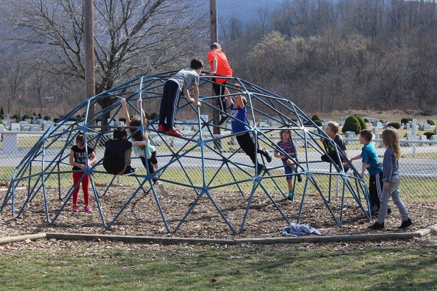 Children at Myers play at recess during the recent February heat wave.