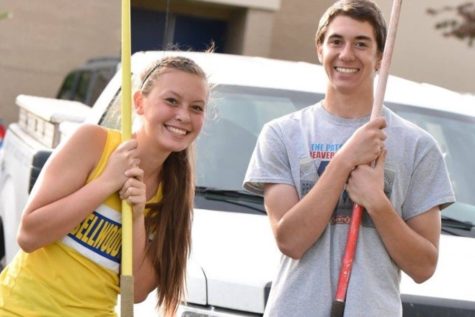 Tina Hollen, posing with Brendan Kowalski, is steadily improving in the javelin.