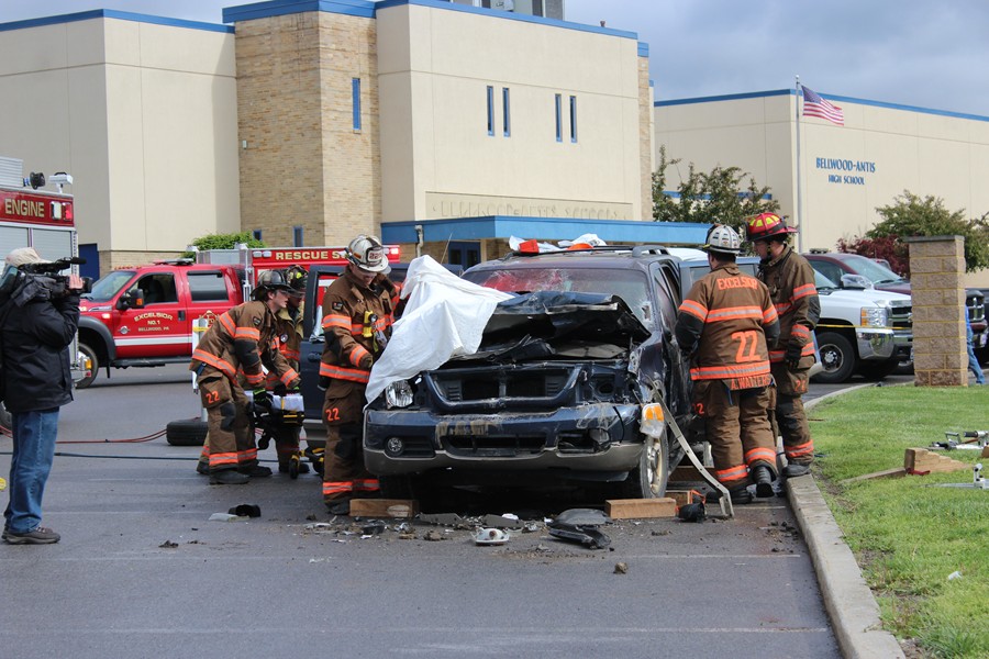 Fire Department volunteers show students the dangers of reckless driving on the road. 