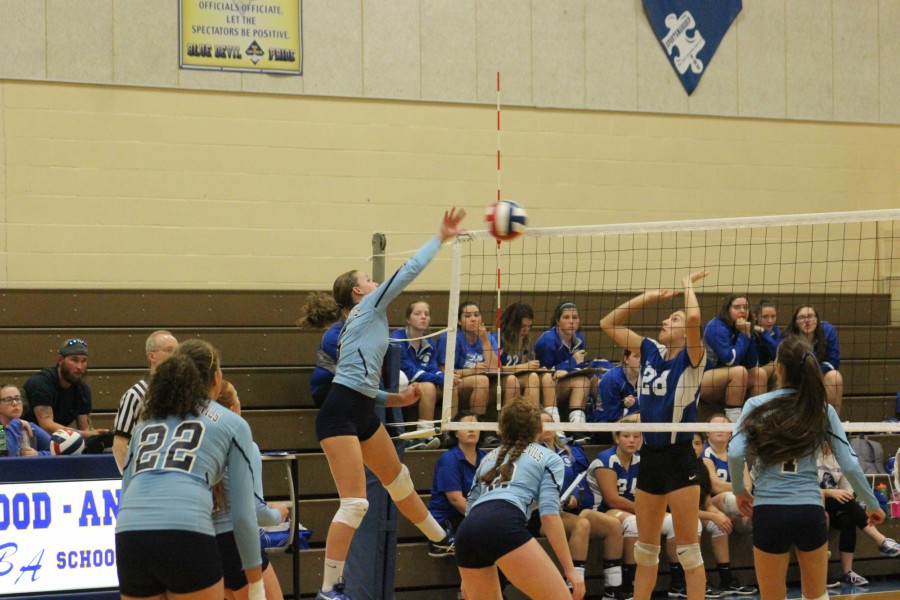 Bella Kies goes for the spike in the volleyball team's big win over Williamsburg.