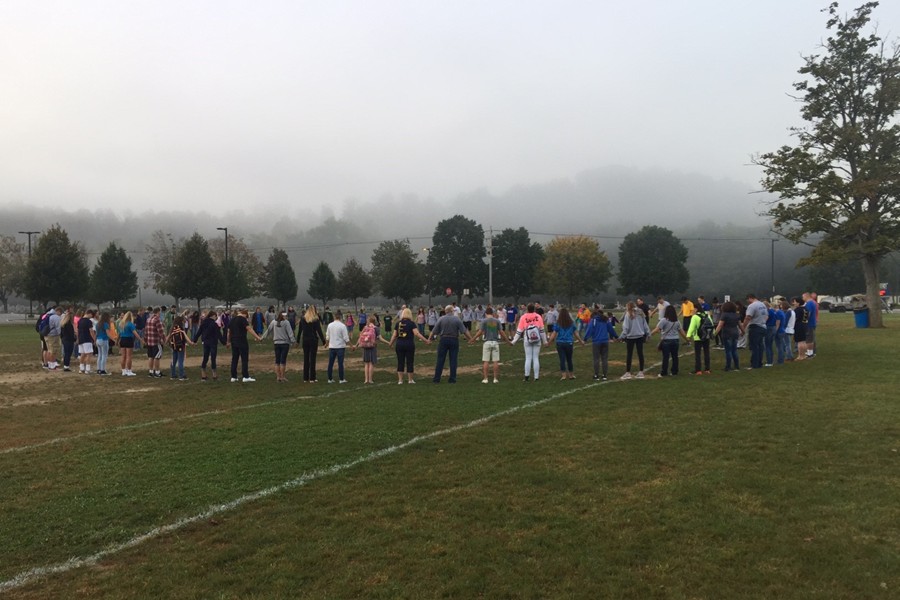 Students and community members pray together before school at See You at the Pole.