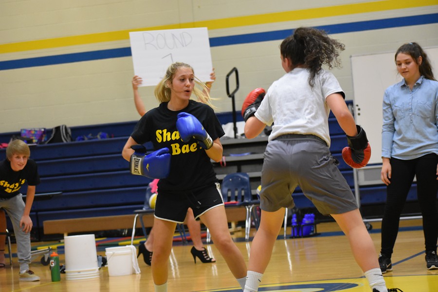 Shayla Branstetter and Emilee Leidig duke it out at Skit Night.