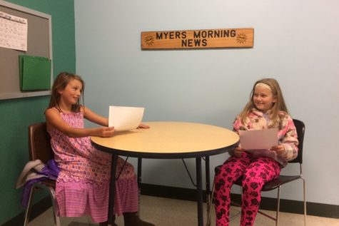 Julie and Abby prepare their script for a broadcast of Myers Morning News.
