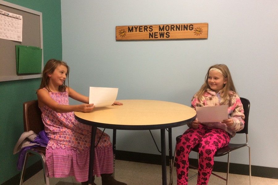 Julie+and+Abby+prepare+their+script+for+a+broadcast+of+Myers+Morning+News.