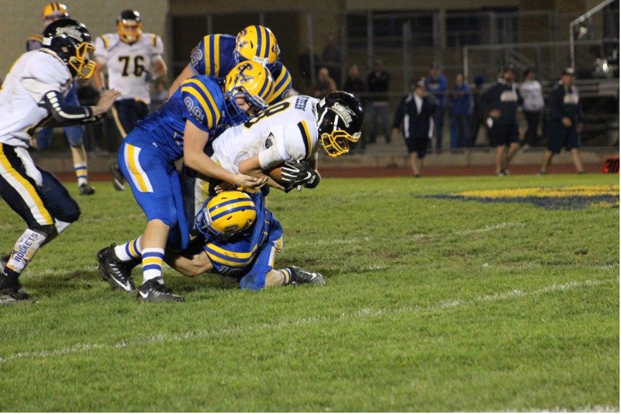 The Blue Devils football team has adopted a tackling philosophy of going low and wrapping the legs in order to make the sport safer.