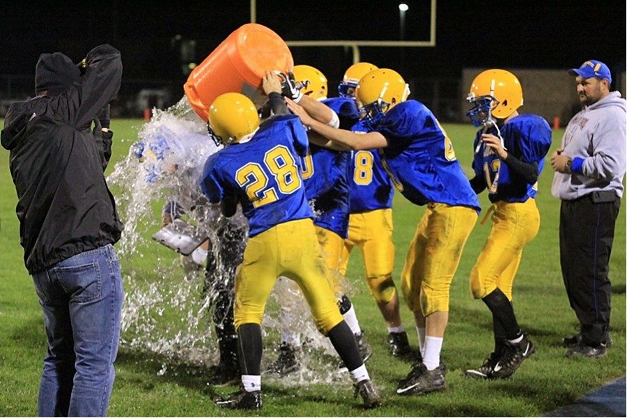 Coach Burch receives a water bucket shower at the end of the game last week. B-A defeated Southern Huntingdon to finish the season undefeated and win the ICC title.