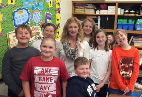 Mrs. Kuhn hanging out with some of her fifth grade students.