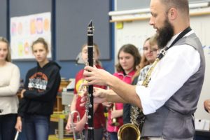Mr. Sachse demonstrates finger positioning on the clarinet.