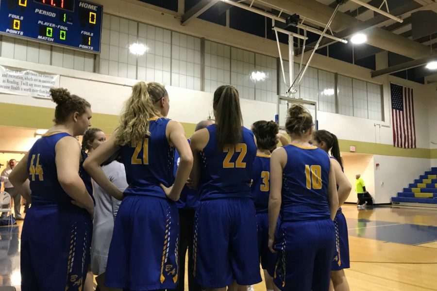 The Lady Devils huddle one last time before taking the floor against Mount Union.