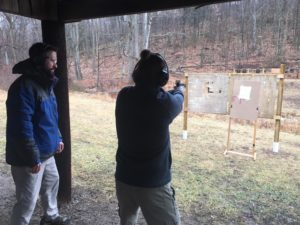 Mr. McNaul finishes up his last-minuyte tips to Mr. Naylor as they shoot at the Blair County Game, Fish and Forestry Association.