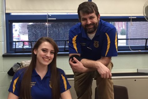 Mr. Webreck and FFA Parlimentarian Johanna Whiteford smile for a picture.