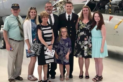 B-A grad Adam Davensizer, shown here with his family, recently received his US Navy Wings of Gold.
