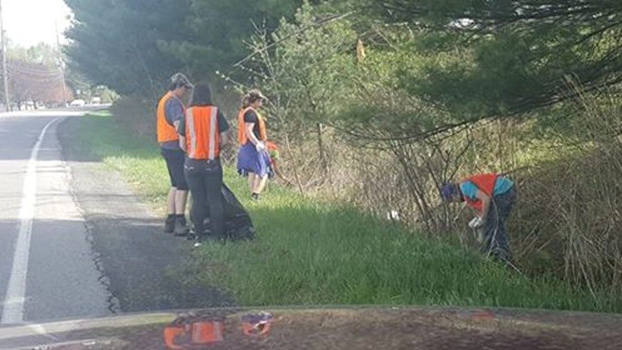 The band helped clean off a section of highway near the high school last weekend.