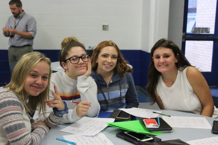 Kaitlyn Dickinson, Isabella Barbosa, Sydney Lechner and Caitlyn McCartney make plans at Aevidum club.