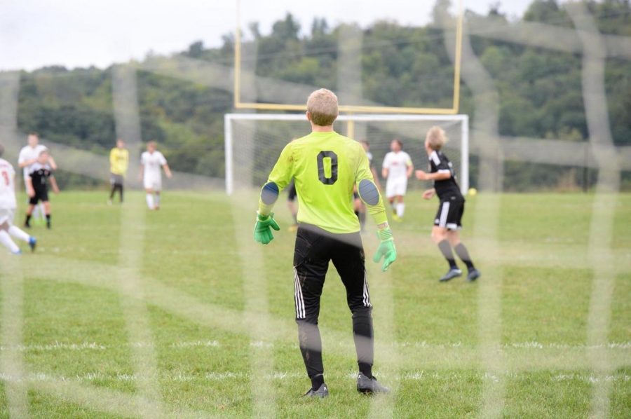 Alex Roberts waits in goal for the co-op soccer team.