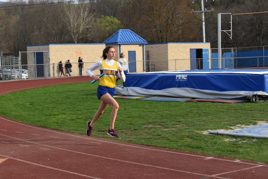 Sophia Nelson completes a lap for her relay team.