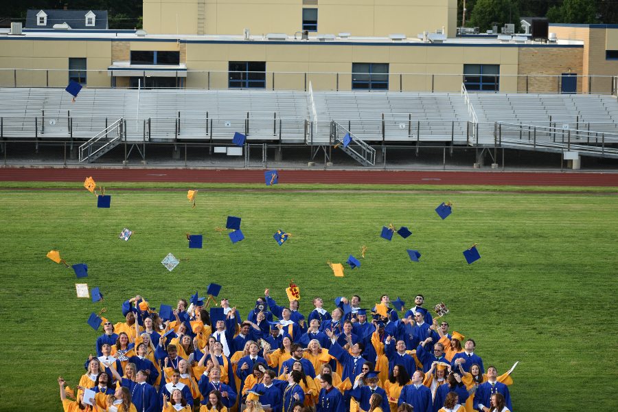 Seniors let their caps fly at the end of the 2019 Commencement Ceremony at Memorial Stadium.
